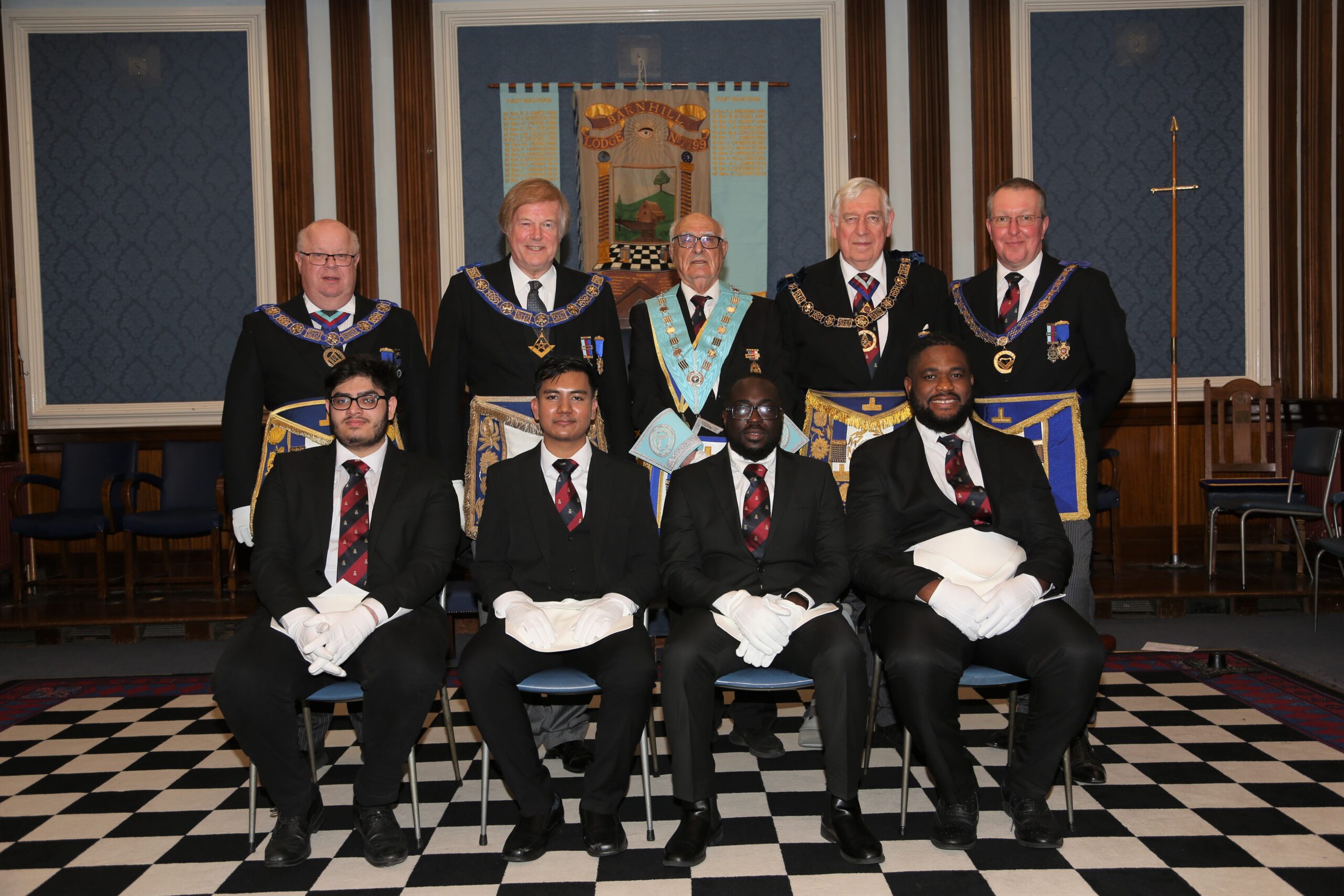 BACK ROW L TO R: JAMES HILDITCH (President of the University Scheme and PGM of Oxfordshire), SIR DAVID WOOTTON (Chairman of the University Scheme and DGM), DR FIRIAD HIWAIZI (WM of the Lodge), PETER BAKER (ProPGM), JIM MITCHELL (APGM). FRONT ROW: L TO R: Bros RAFAAY, EAYAN, STANLEY AND KITZI.