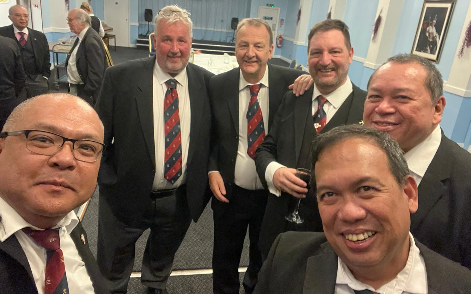 From L to R: Comp. Romel Catalan (the new Exaltee); E.Comp Steve Cook (Treas.) E. Comp Paul Bennett (MEZ); Comp. Andy Pearce (Scribe E); Comp. Achilles Malinit (2nd Assistant Soj); and Comp. Felix Penas. In the background is E. Comp. Hemant Vyas talking with Comp. Cheren Toms the recipient of the 50 year certificate.