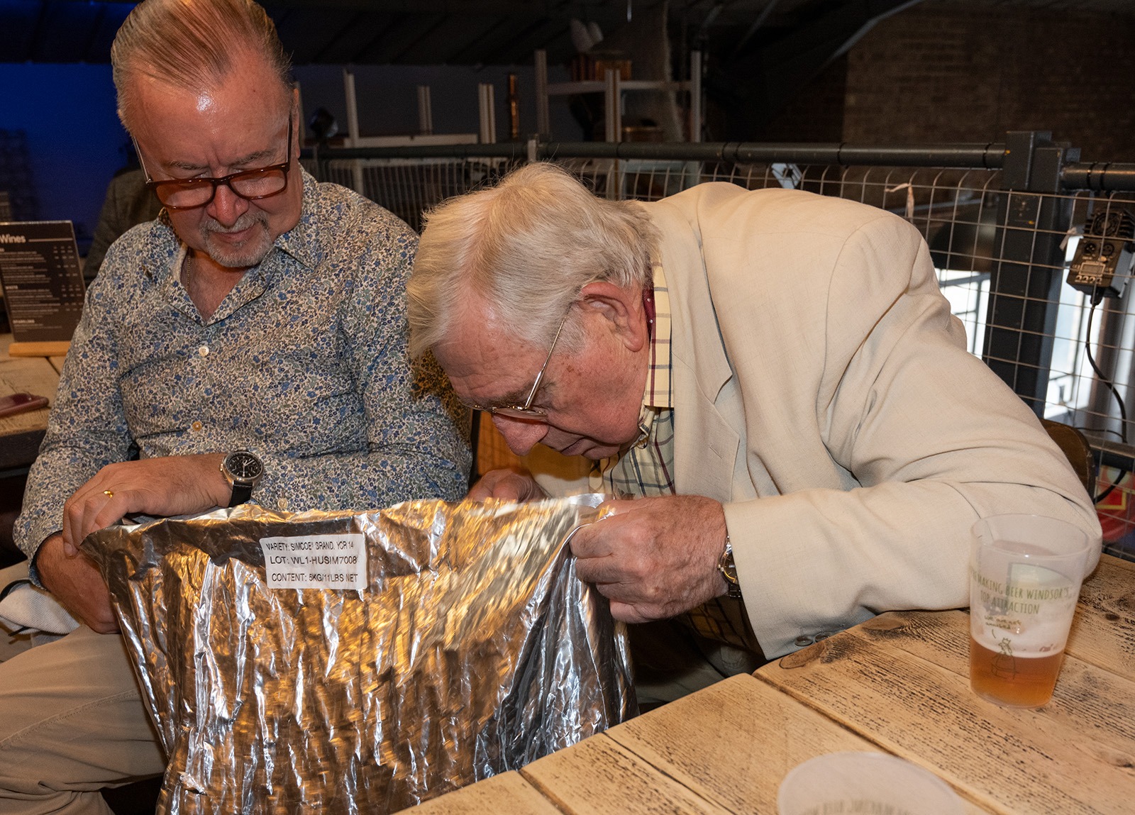 R W Bro Peter smelling the hops!