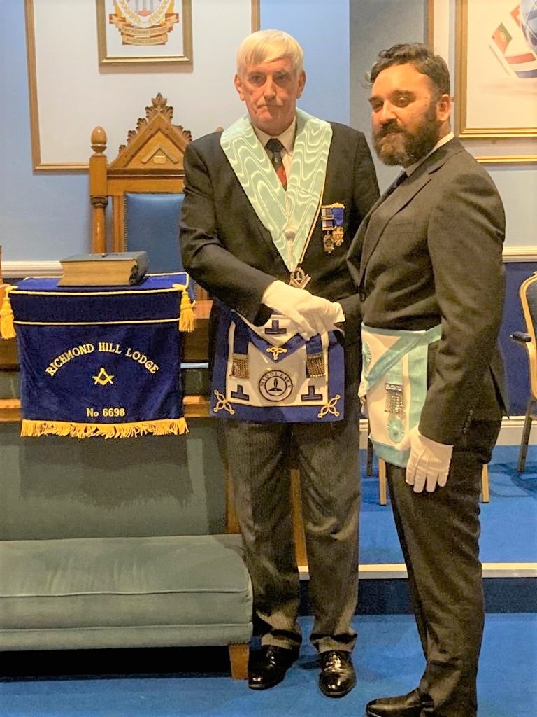 W. Bro Robert McLintock, Lodge Secretary, welcomes newly raised Brother Ashley Pandoo back to Middlesex Freemasonry.